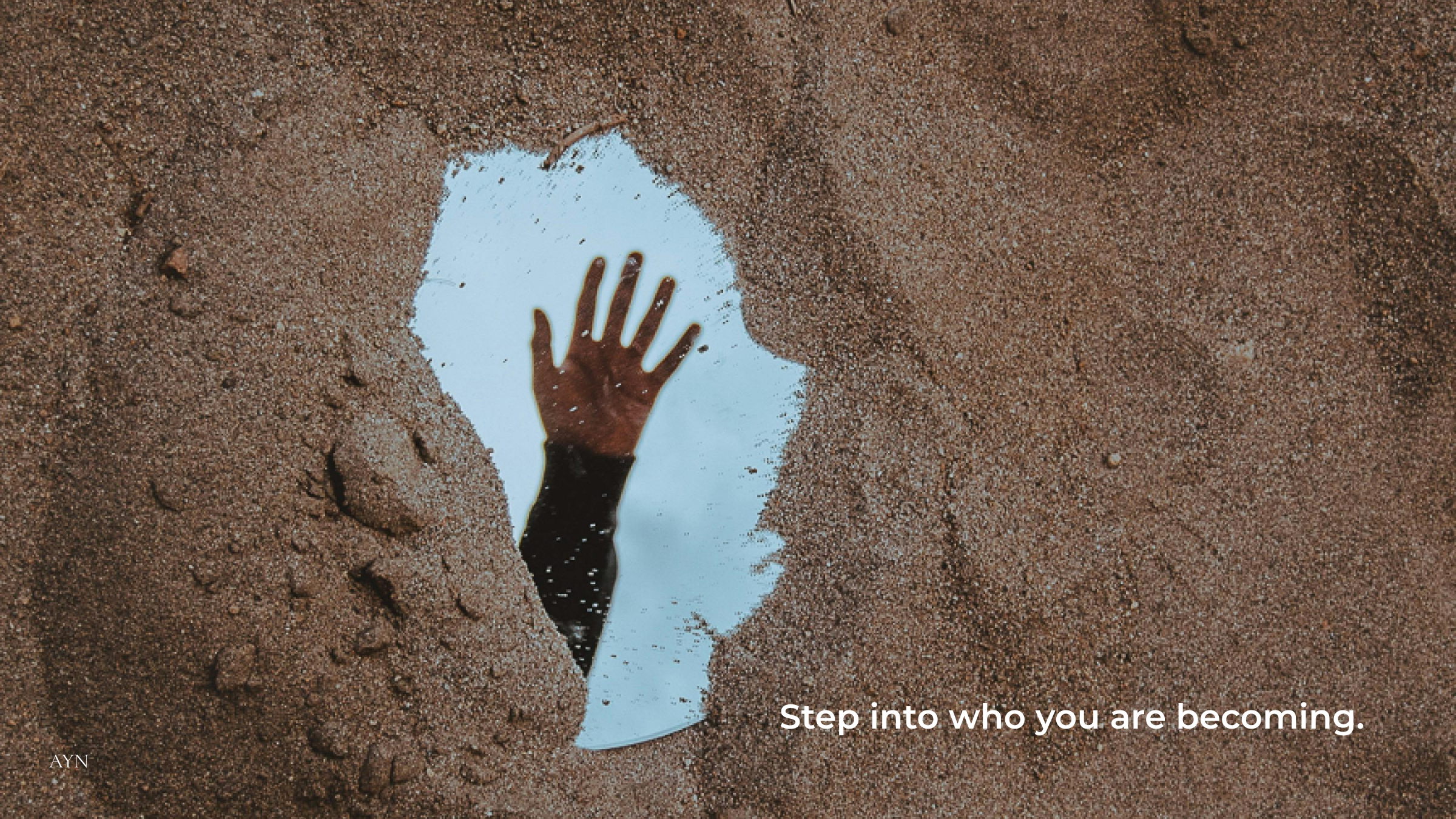 Step into who you are becoming motivational wallpaper showing a hand reaching through sand toward the sky